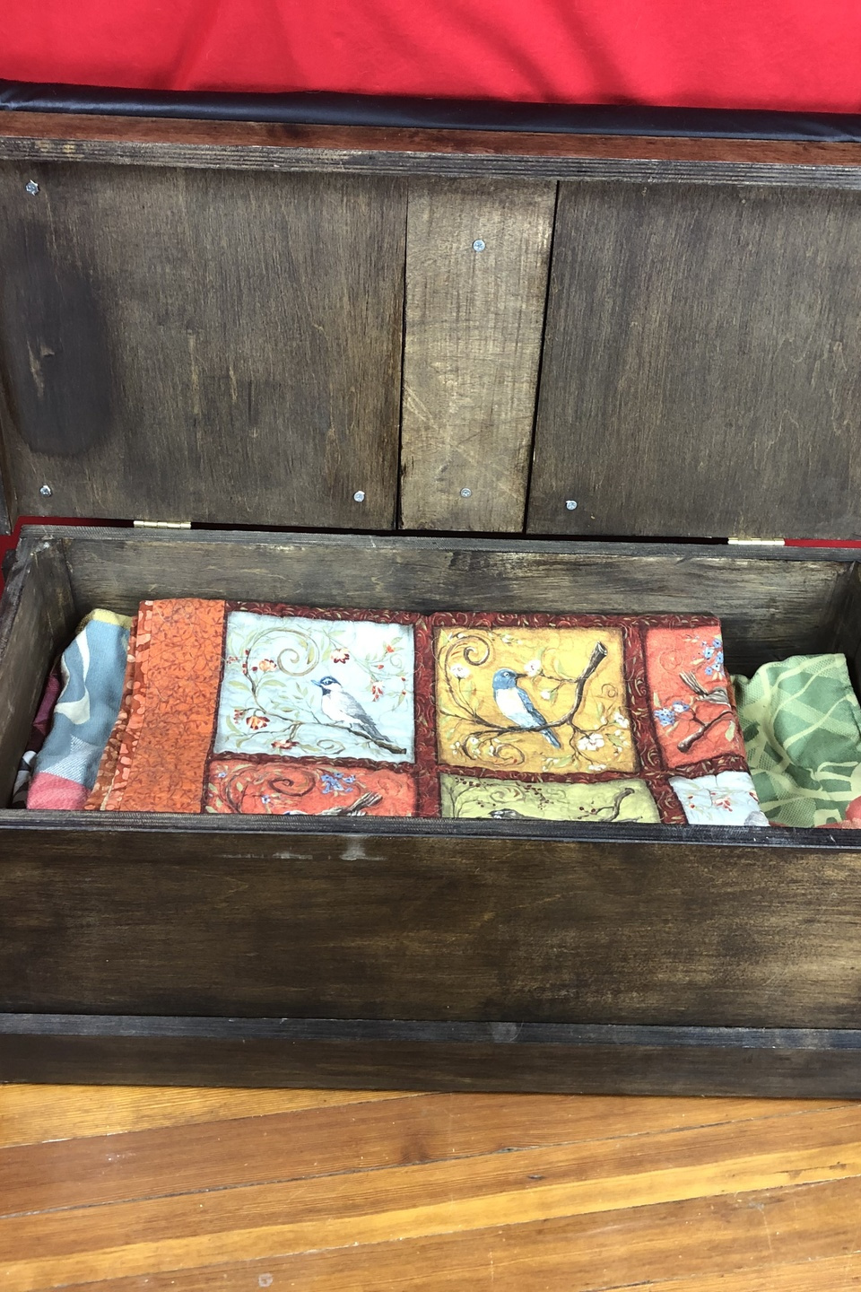 Trunk open showing blankets inside